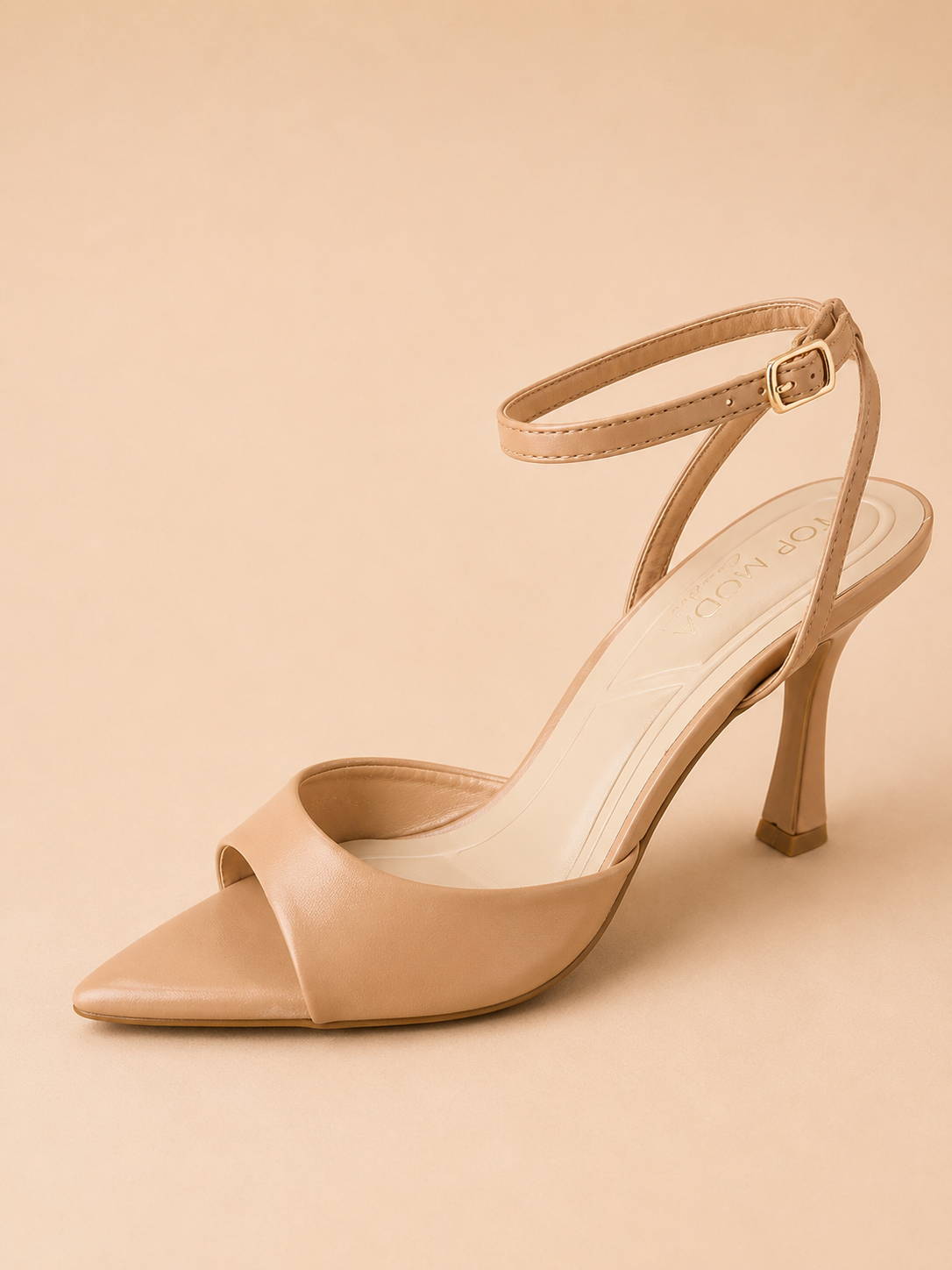 Beige high-heeled sandal on a beige background